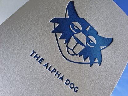 The card is letterpress printed using a custom blue ink.