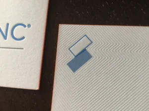 Blind deboss texture printed on cotton letterpress business cards with tight register.