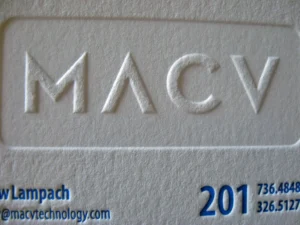 Closeup of faux emboss effect on thick cotton business card